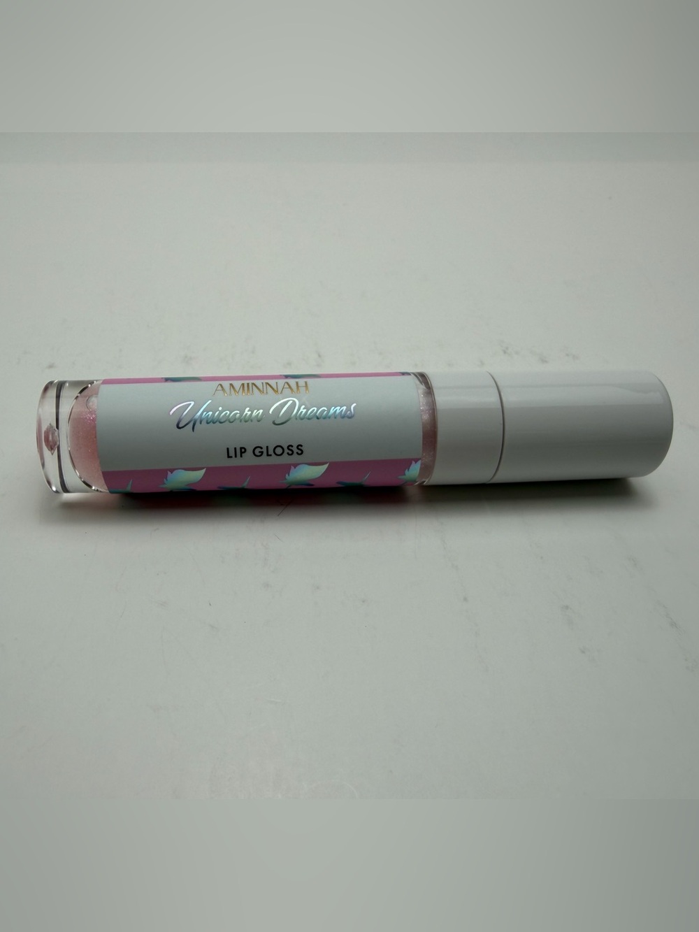 AMINNAH Unicorn Dreams Lip Gloss — Sheer Pearl Pink Shine